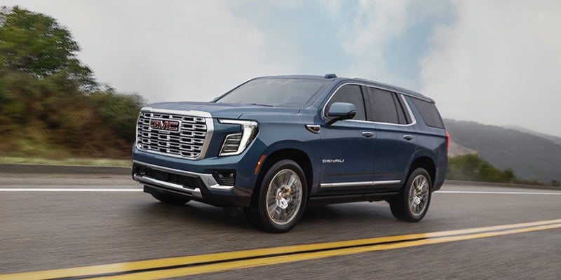 2026 GMC Yukon Denali driving on road